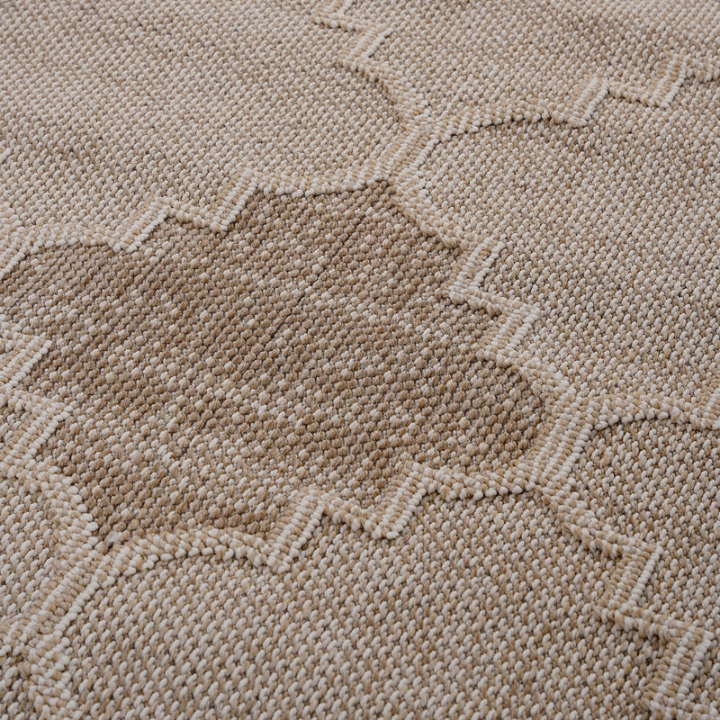 Beige trellis rug close-up with woven texture and raised geometric motifs