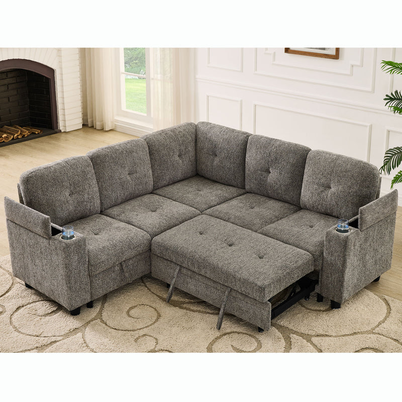 Gray sectional sofa with pull-out sleeper bed, padded armrests, and storage chaise