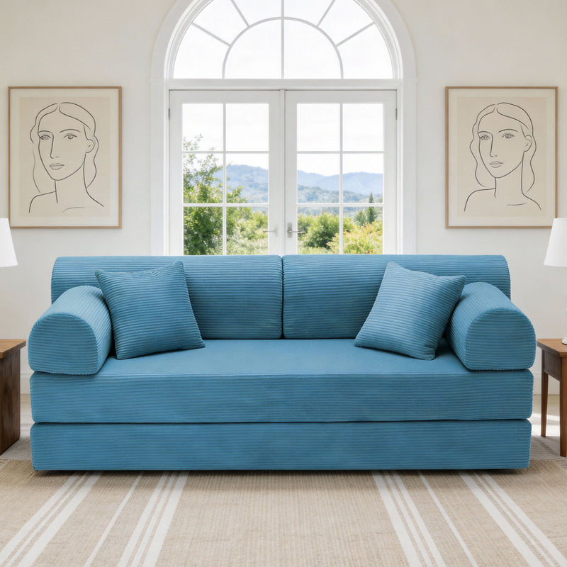 Light blue convertible sleeper sofa bed with rounded arms and three seat cushions