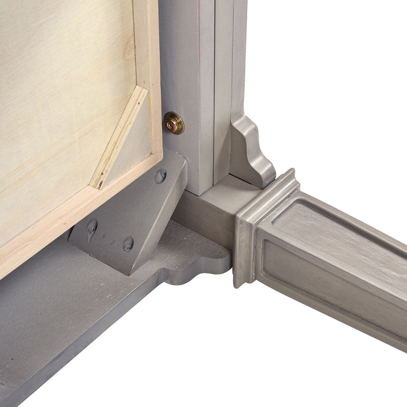 Gray desk corner with three-drawer base and gold-toned knob detail