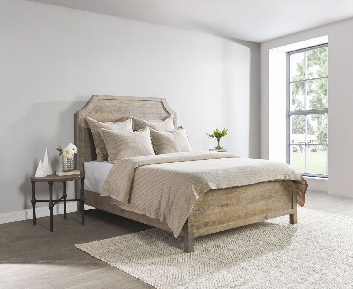 Beige textured duvet with coordinating pillows on bed