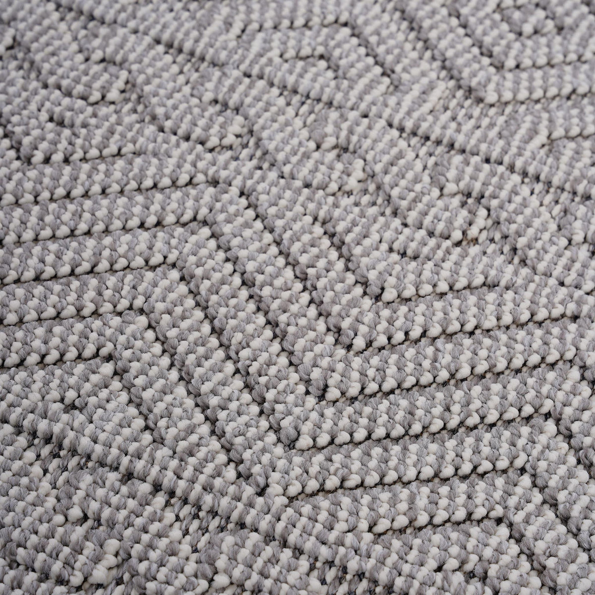 Geometric indoor/outdoor area rug texture in light gray with short looped pile
