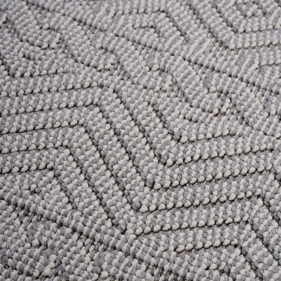 Geometric indoor/outdoor area rug texture in light gray with short looped pile