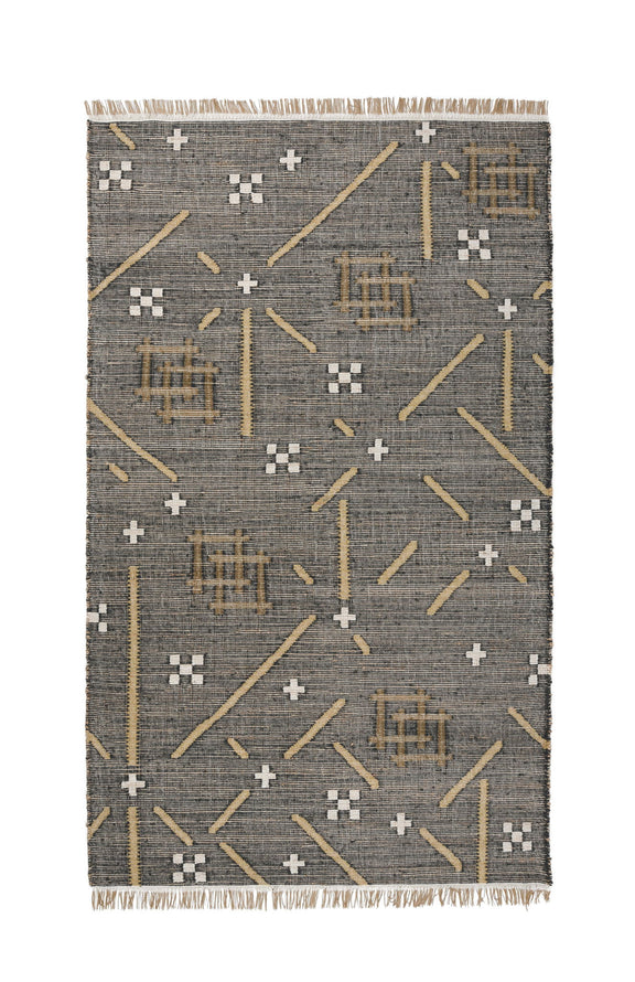 Charcoal area rug with gold and white geometric plus and line motifs, fringed