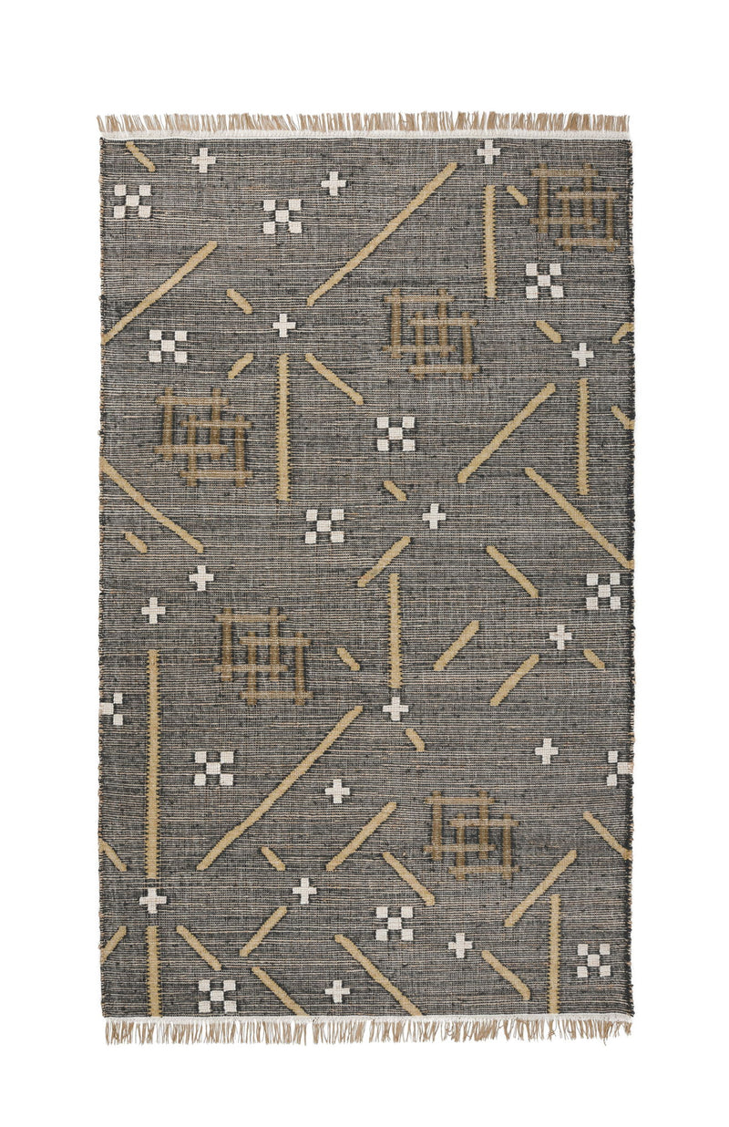 Charcoal area rug with gold and white geometric plus and line motifs, fringed