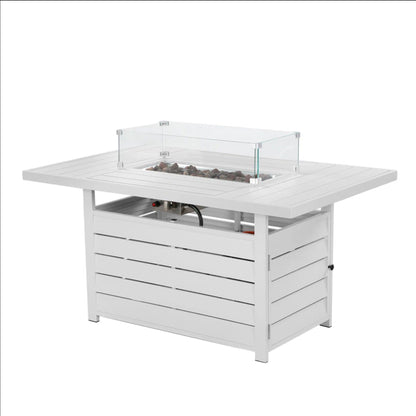 White rectangular propane fire pit table with clear glass windscreen and lava rocks