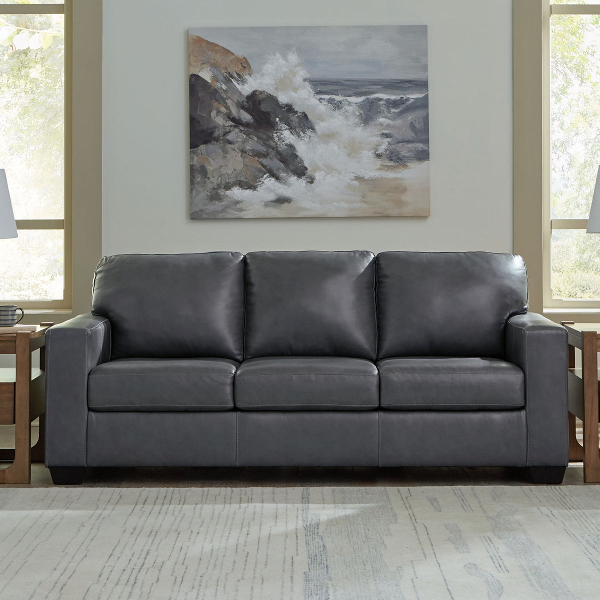 Dark gray 3-seat sofa with plush cushions and boxy padded arms