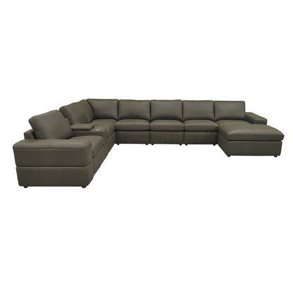 Modular sectional sofa in dark green with large square arms and chaise-style ottoman
