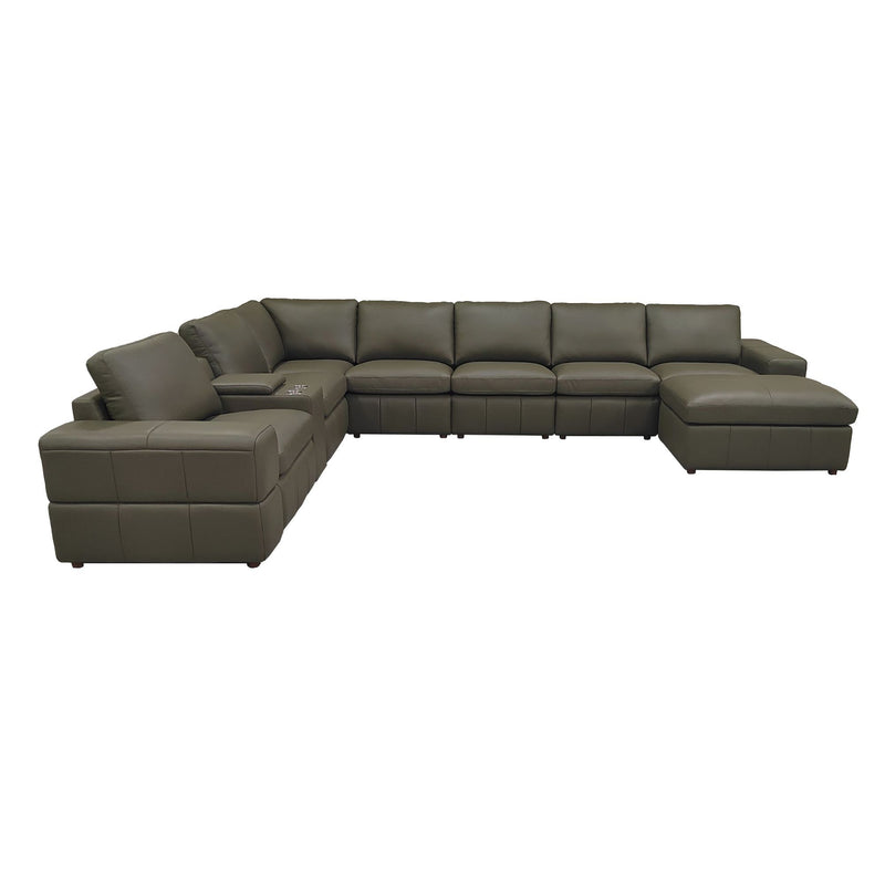 Modular sectional sofa in dark green with large square arms and chaise-style ottoman