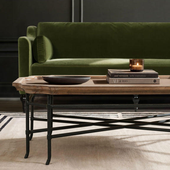 Antique brown coffee table with black metal frame and open x-style support