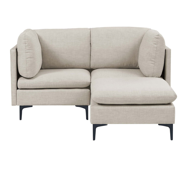 Beige upholstered sectional with tall legs and chaise ottoman with rounded arm