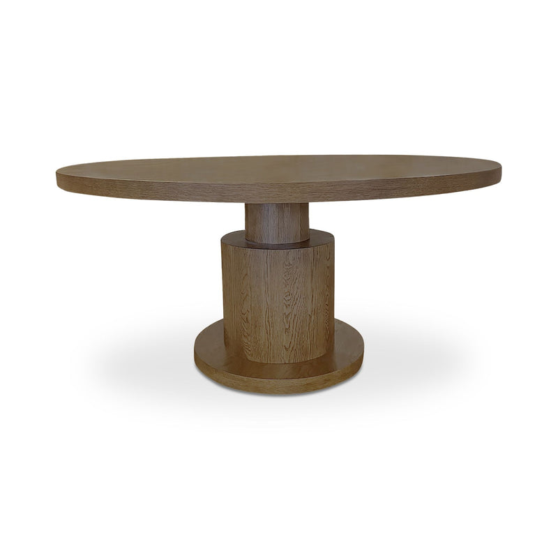 Round brown dining table with a thick top and stepped cylindrical pedestal base