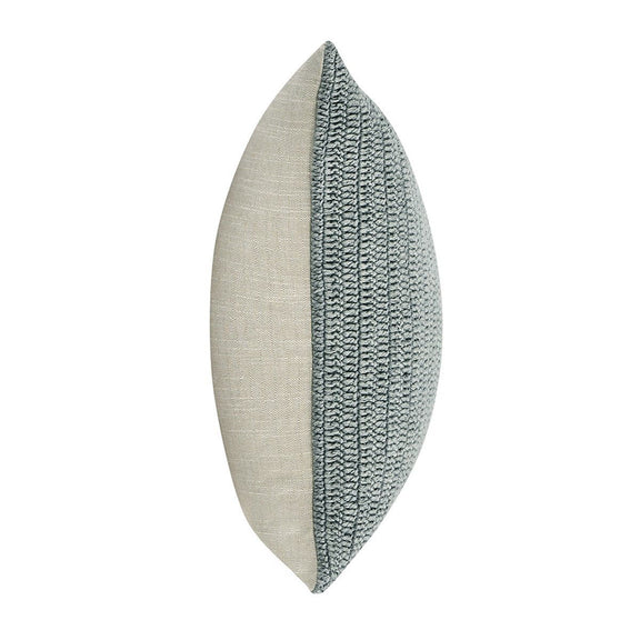 Lumbar pillow side view with light backing and blue textured woven front