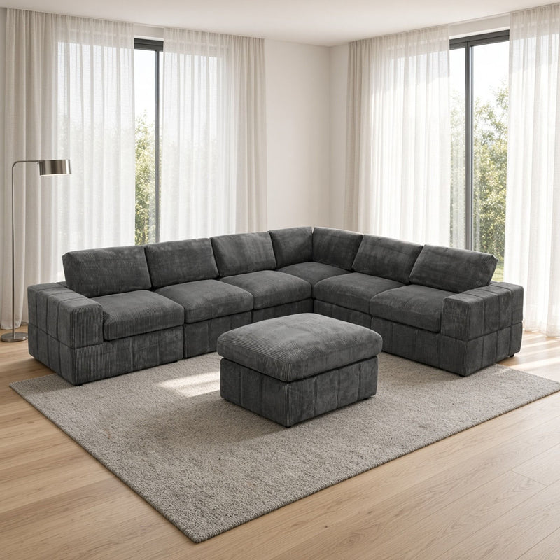 Dark gray L-shaped sectional sofa with matching square ottoman