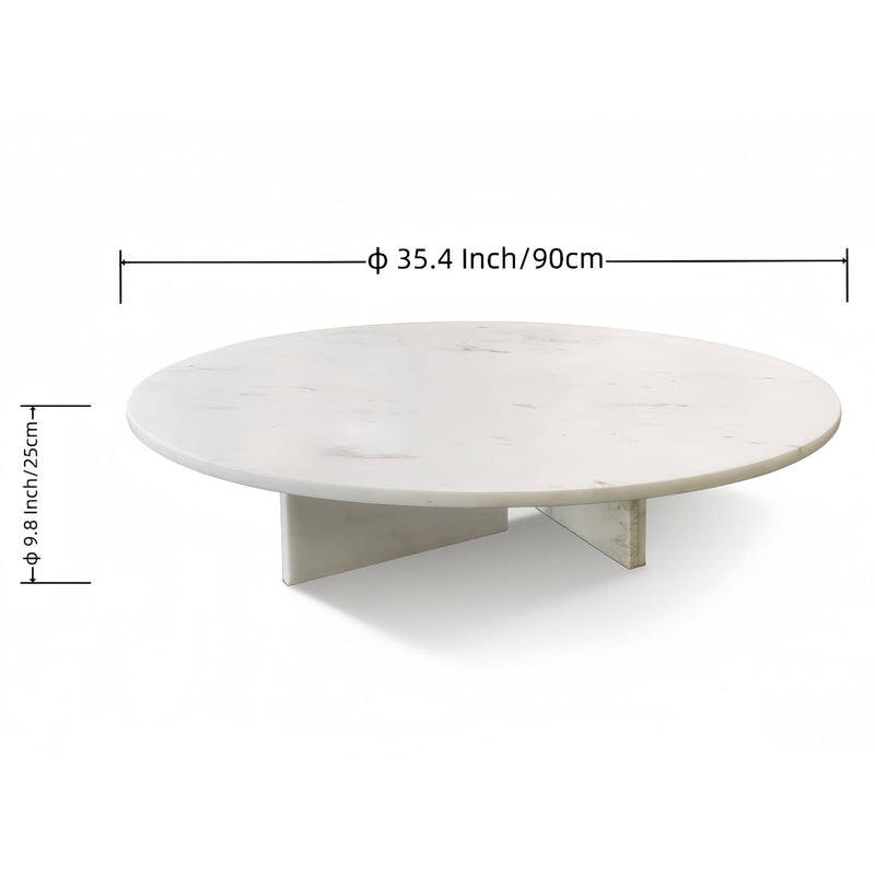 White round stone coffee table with faint gray veining and angular support base