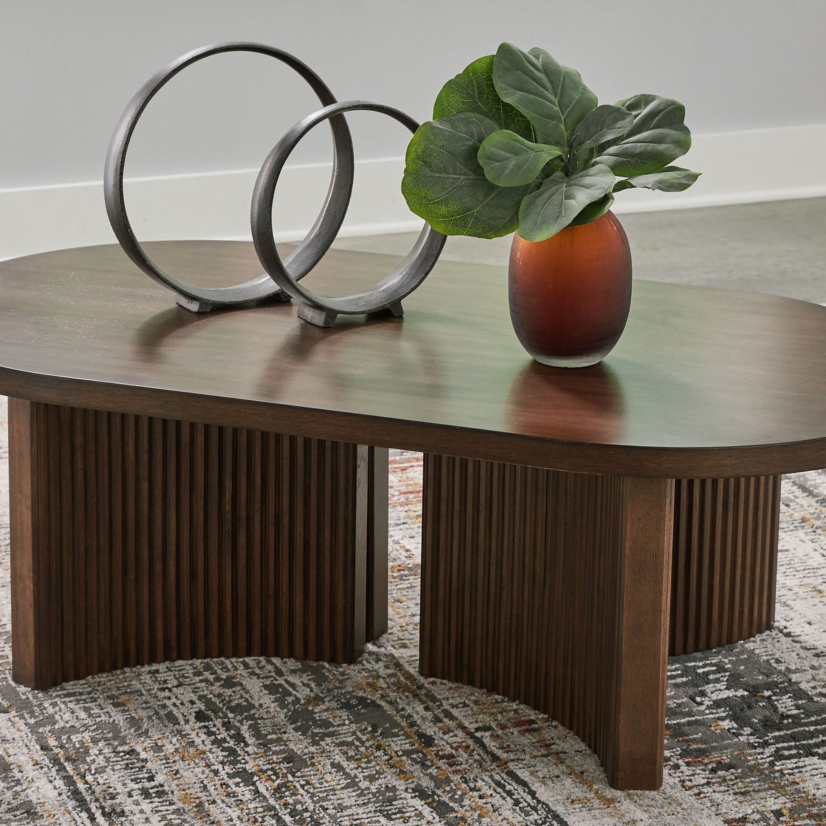 Korestone - Oval Cocktail Table - Dark Brown