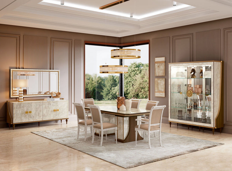 Dining table with two extensions, light beige top and walnut pedestal base in dining room