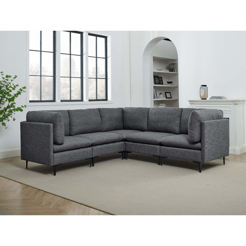 Dark gray modular sectional sofa with tall legs, curved arms, and box cushions