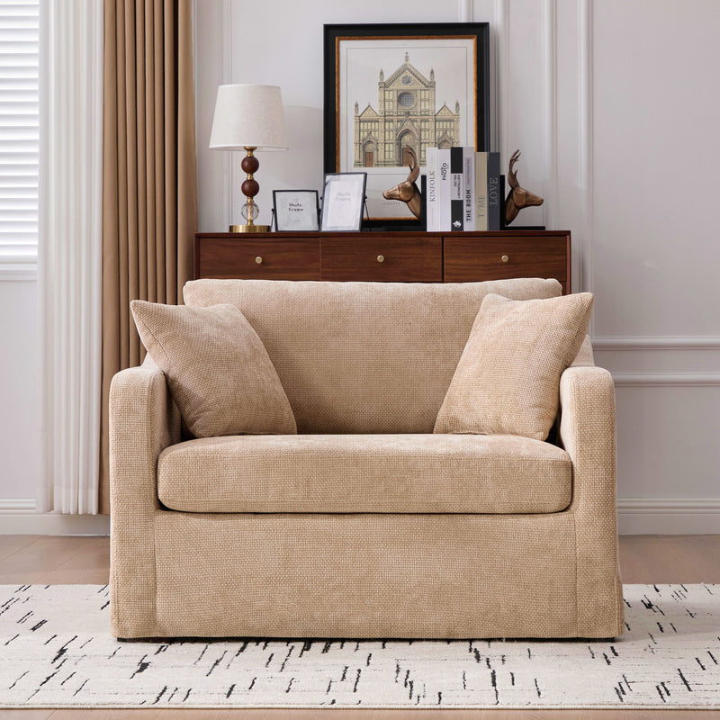 Light beige fabric accent chair with 2 bolster pillows, track arms, supportive seat