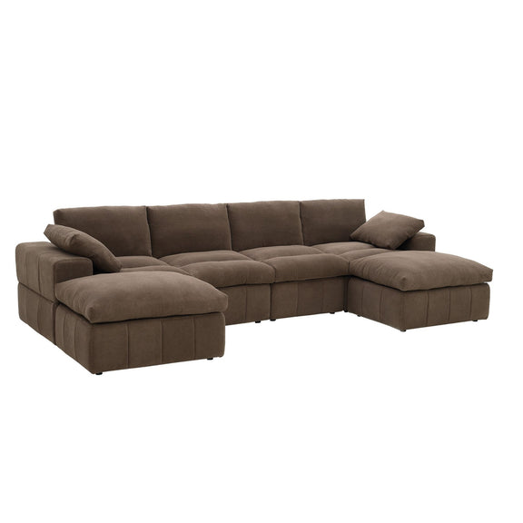 Dark brown sectional sofa with two chaise ends and loose toss pillows