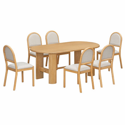 Light brown oval dining table with six upholstered chairs, rounded backs and fabric seats