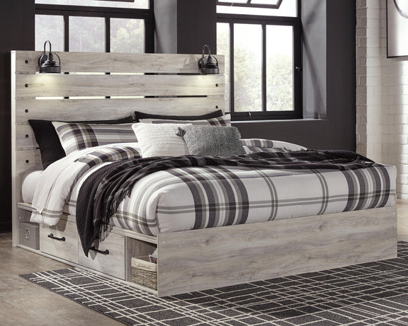 Cambeck panel bed with light wood frame, open footboard base, and matching bed linens