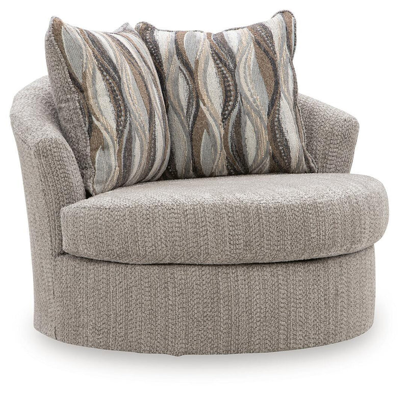 Swivel accent chair in textured gray fabric with striped throw pillows, rounded arms