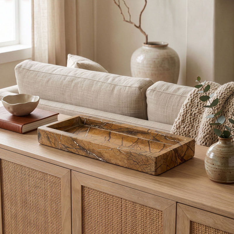 Marble tray on a wooden table with stones and keys for display