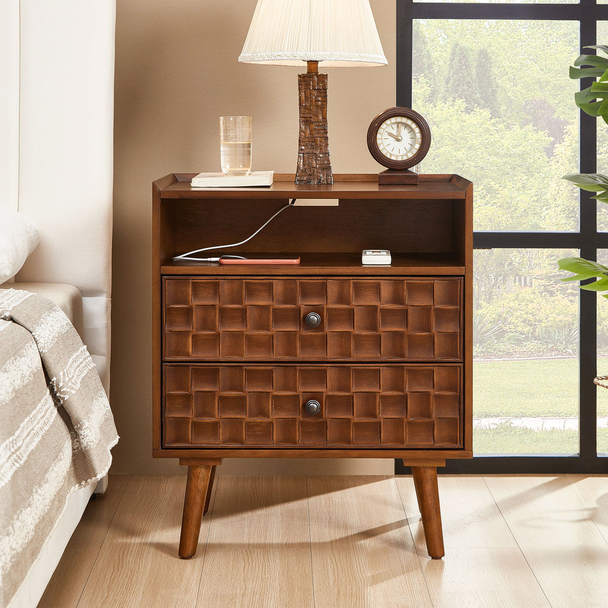 Dark brown nightstand with two drawers, open shelf, and charging cable