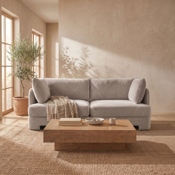 Light gray velvet upholstered 2-piece loveseat with two seat sections and bolster pillows