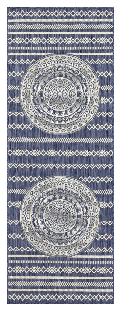 Indoor/outdoor area rug with blue circular medallion design and diamond stripe border