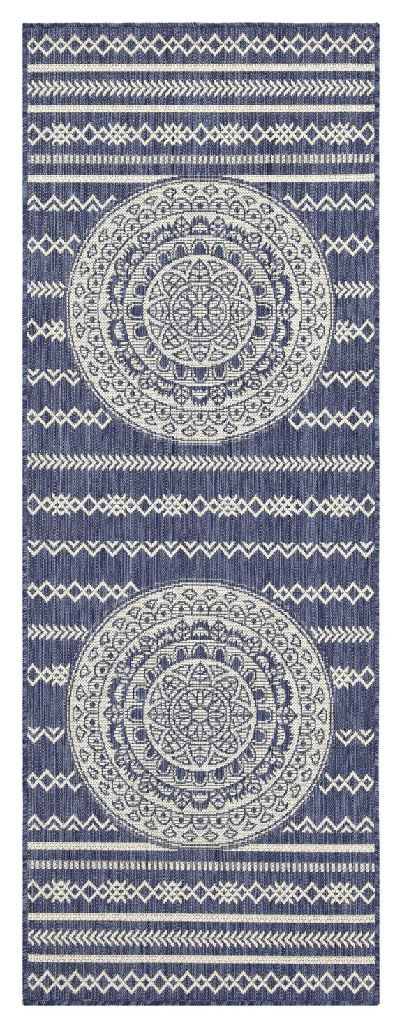 Indoor/outdoor area rug with dark navy background, light blue medallion motifs, and banded border