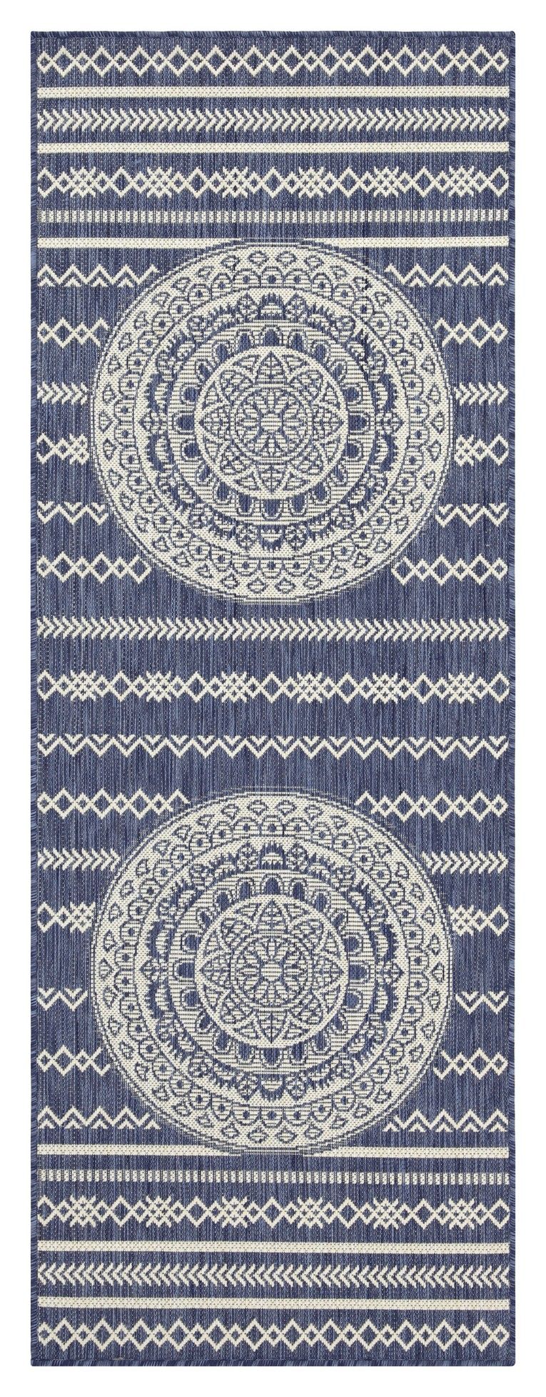 Indoor/outdoor area rug with dark navy background, light blue medallion motifs, and banded border