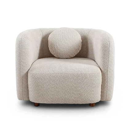 Beige upholstered accent square chair with rounded arms, thick seat, and wood legs.