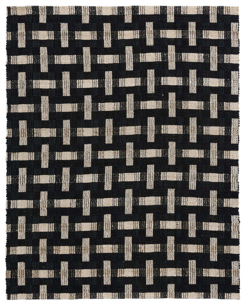 Black and ivory geometric pattern rug with repeating T-shaped block design