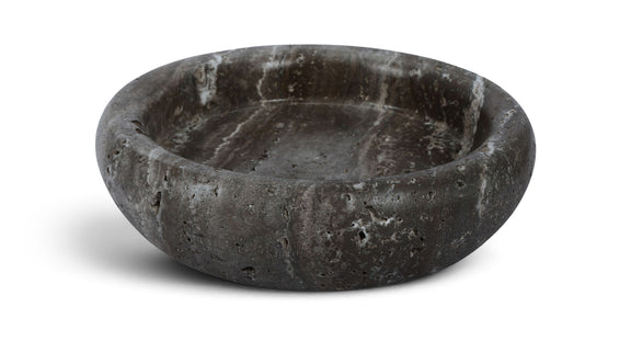 Gray genuine travertine tray with shallow round basin, rough speckled texture.