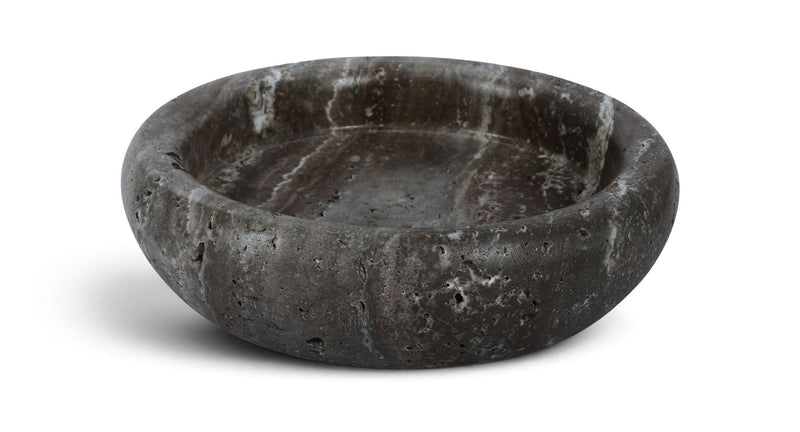 Gray genuine travertine tray with shallow round basin, rough speckled texture.