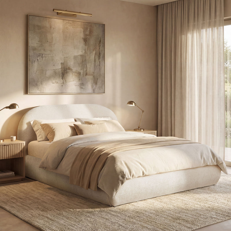 Beige upholstered platform bed with curved headboard and cushioned base