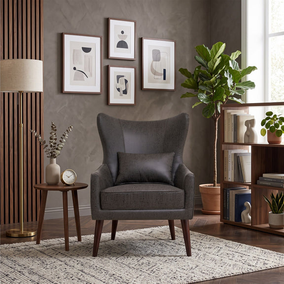 Curved-back lounge chair in charcoal fabric with square arms and cushioned seat.