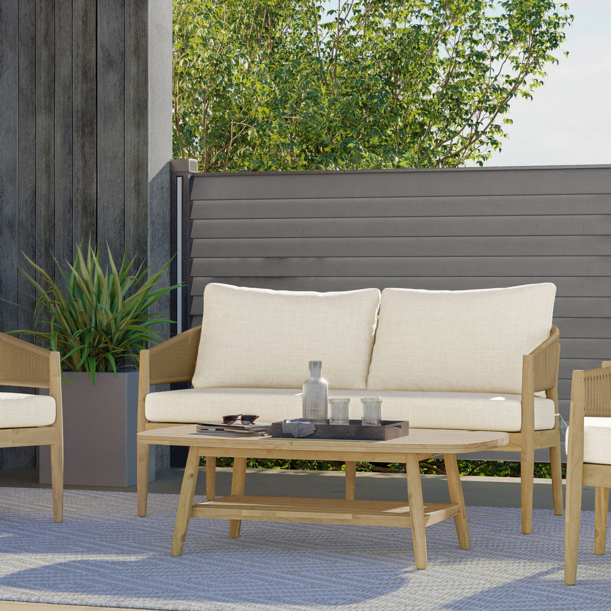 Outdoor coffee table in light teak with slatted top and lower shelf