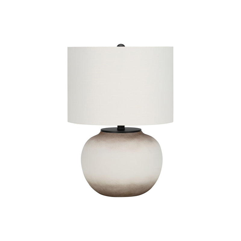 Cream ceramic table lamp with round base and white fabric drum shade