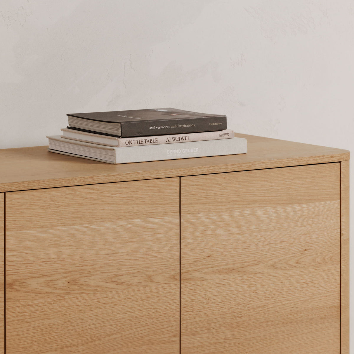 Light brown oak sideboard with two doors and smooth wood top surface