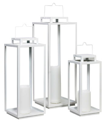 Set of three white metal outdoor lanterns with glass panels and pillar candles