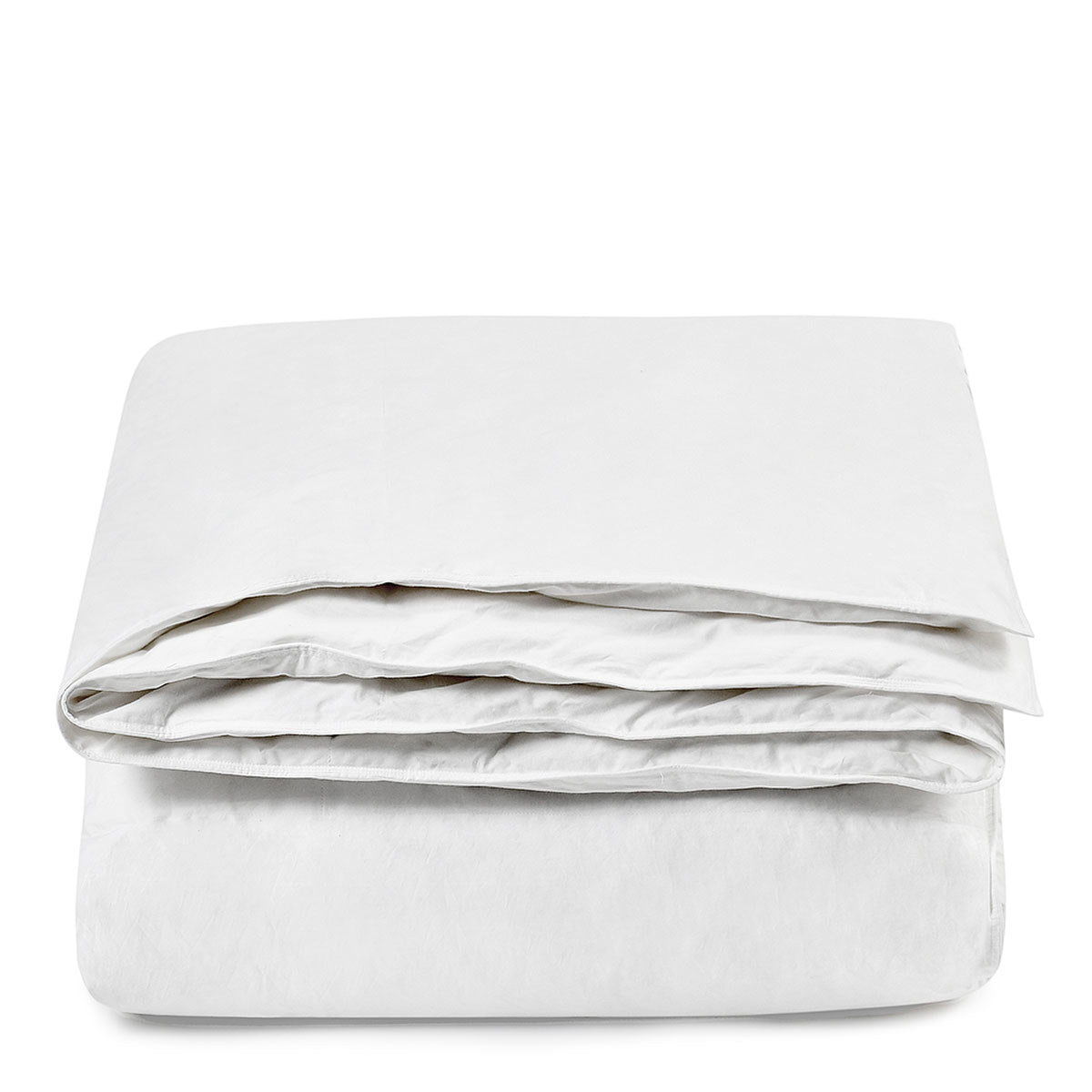White goose down sham insert, neatly stacked folded bedding