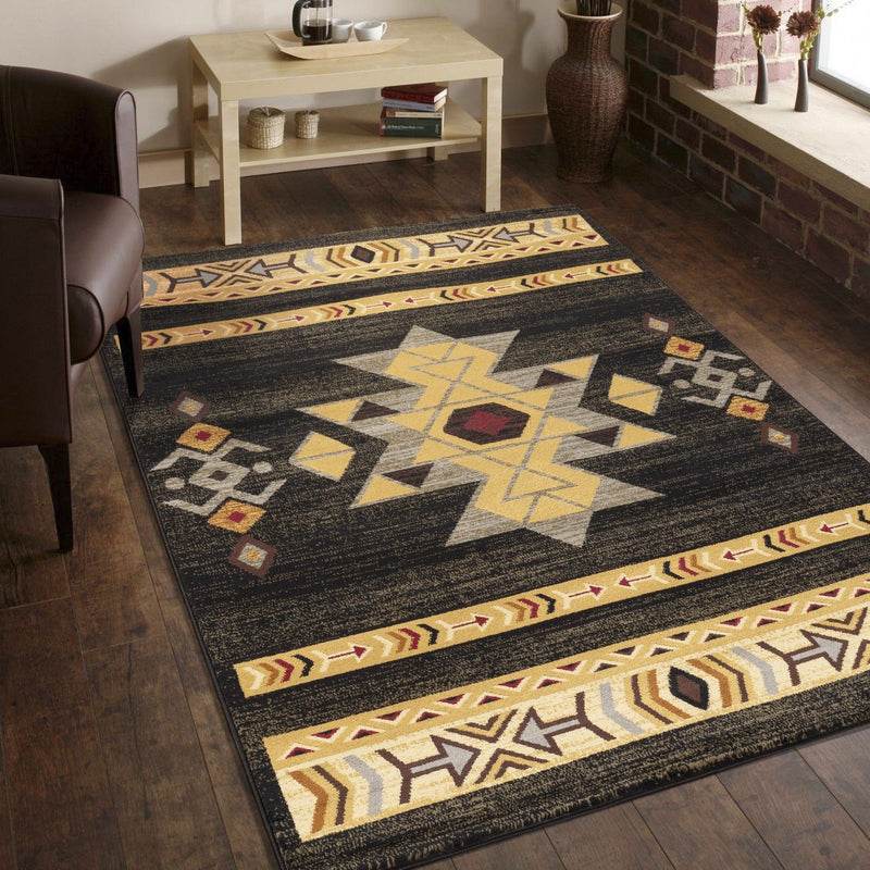 Southwest area rug with dark background, multicolor geometric banding and star shapes