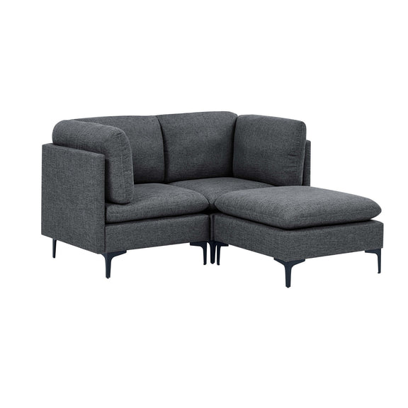 Dark gray upholstered sectional sofa with tall legs, L-shaped chaise and ottoman-style seats