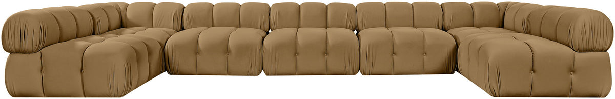 Tan modular U-shaped sectional sofa with tufted cushions and curved corner blocks