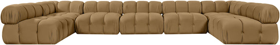 Tan modular U-shaped sectional sofa with tufted cushions and curved corner blocks