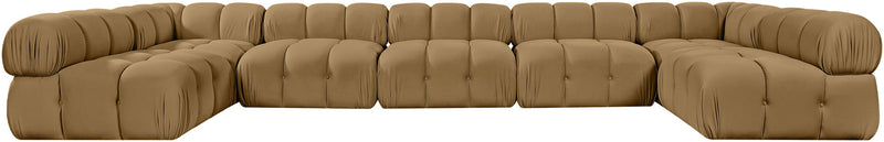 Tan modular U-shaped sectional sofa with tufted cushions and curved corner blocks