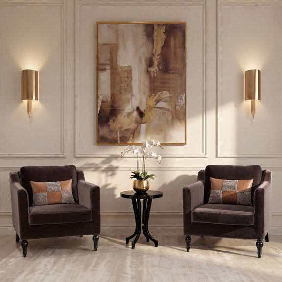 Dark brown upholstered accent chairs with cushioned seats and square arms, with throw pillows